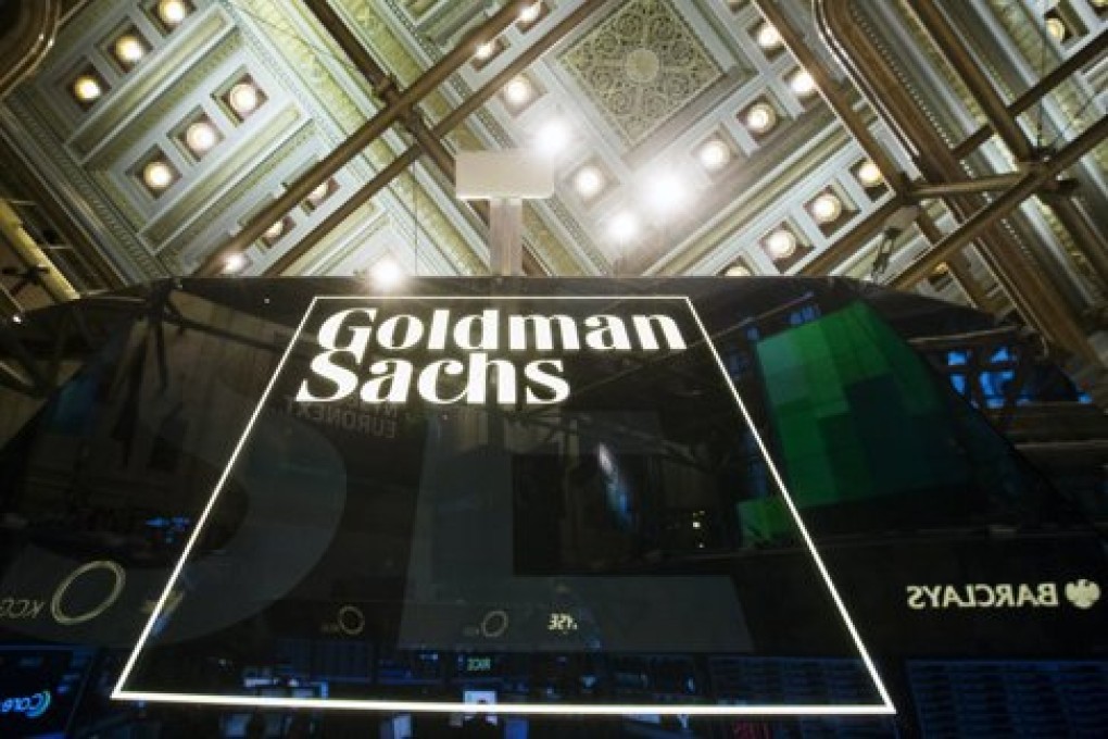 A Goldman Sachs sign is seen above the floor of the New York Stock Exchange shortly after the opening bell in the Manhattan borough of New York, in this January 24, 2014 file photo. Despite record deal volumes in 2015, Wall Street banks are earning less when helping companies raise equity in Asia as Chinese rivals increasingly eat away their margins, a Thomson Reuters quarterly survey of investment banking activity shows. REUTERS/Lucas Jackson/Files