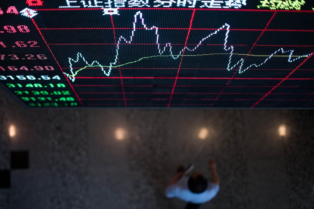 A board shows the stock movements inside the Shanghai Stock Exchange in the Lujiazui Financial district of Shanghai last month. Photo: AFP