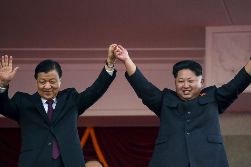 North Korean leader Kim Jong Un (R) and senior Chinese Communist Party official Liu Yunshan wave to the crowd during the parade celebrating the 70th anniversary of the founding of the ruling Workers' Party of Korea, in Pyongyang. Photo: Reuters