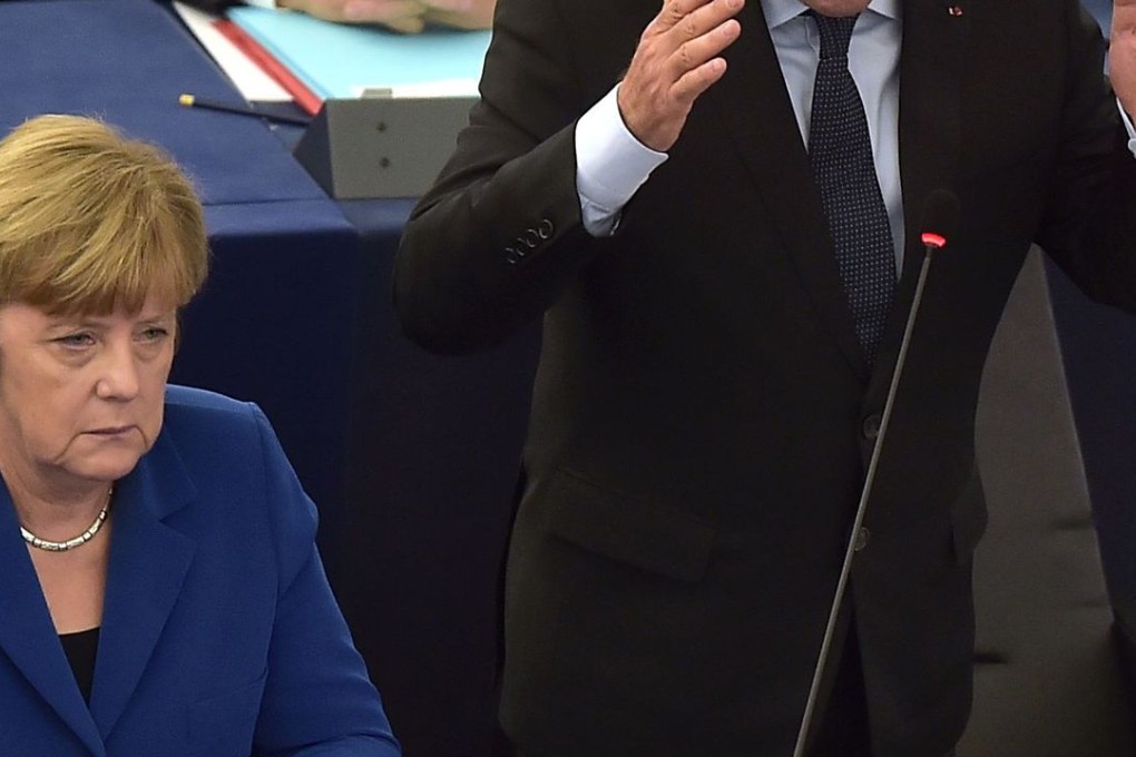 French President Francois Hollande (right) delivers a speech next to German Chancellor Angela Merkel during their joint address at the European Parliament on October 7, in Strasbourg, eastern France. Photo: AFP