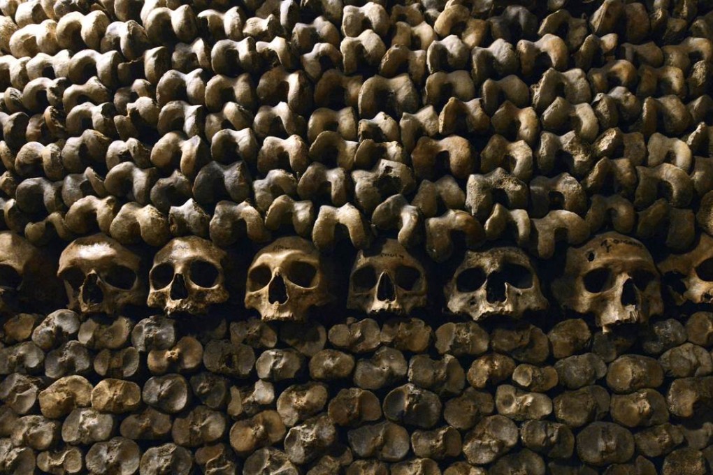 The Catacombs of Paris are lined with skulls and bones stacked and arranged. Photo: AFP