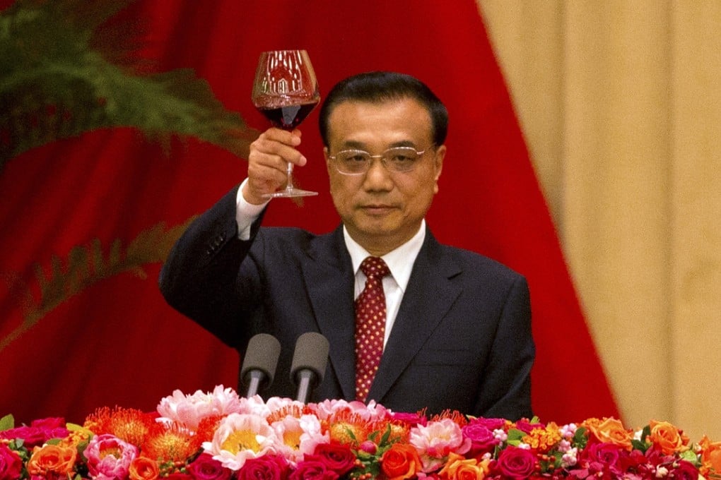 Premier Li Keqiang raises his glass for a toast during a reception at the Great Hall of the People in Beijing. Photo: AP
