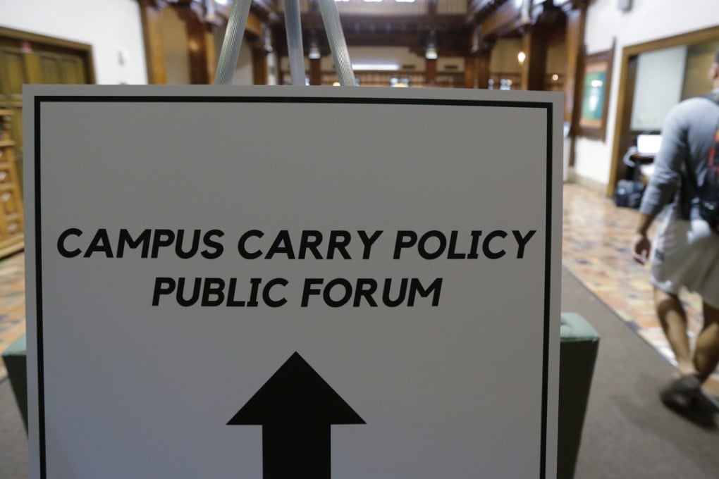 Students arrive a public forum on the University of Texas campus as a special committee studies how to implement a new law allowing students with concealed weapons permits to carry firearms into class. Photo: AP