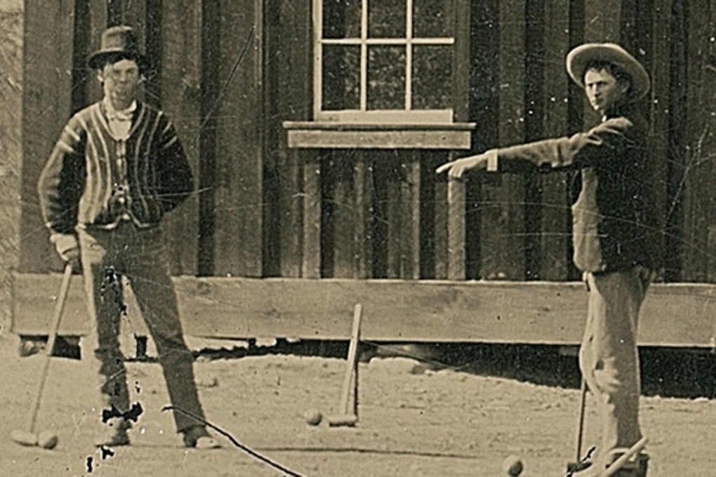 The faded that shows Billy the Kid, left, playing croquet in New Mexico in 1878.