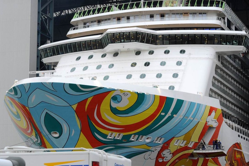 People watch on caravans as cruise ship Norwegian Getaway leaves the shipyard of the Meyer wharf in Papenburg, northern Germany. Photo: AFP