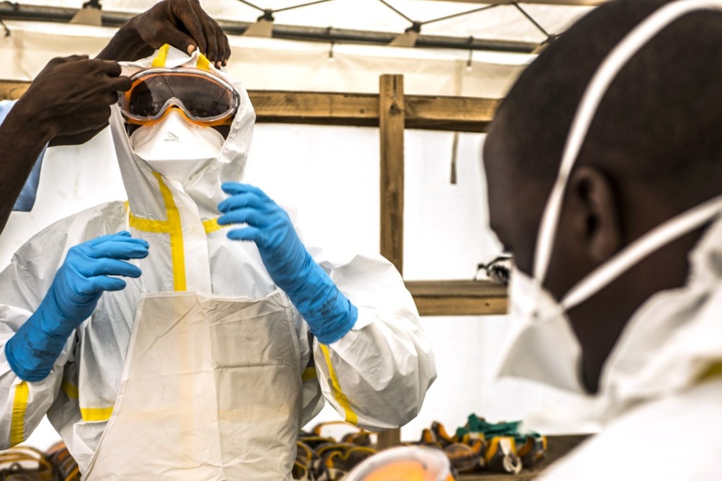Health-care workers at an Ebola Treatment Centre. Photo: Bloomberg