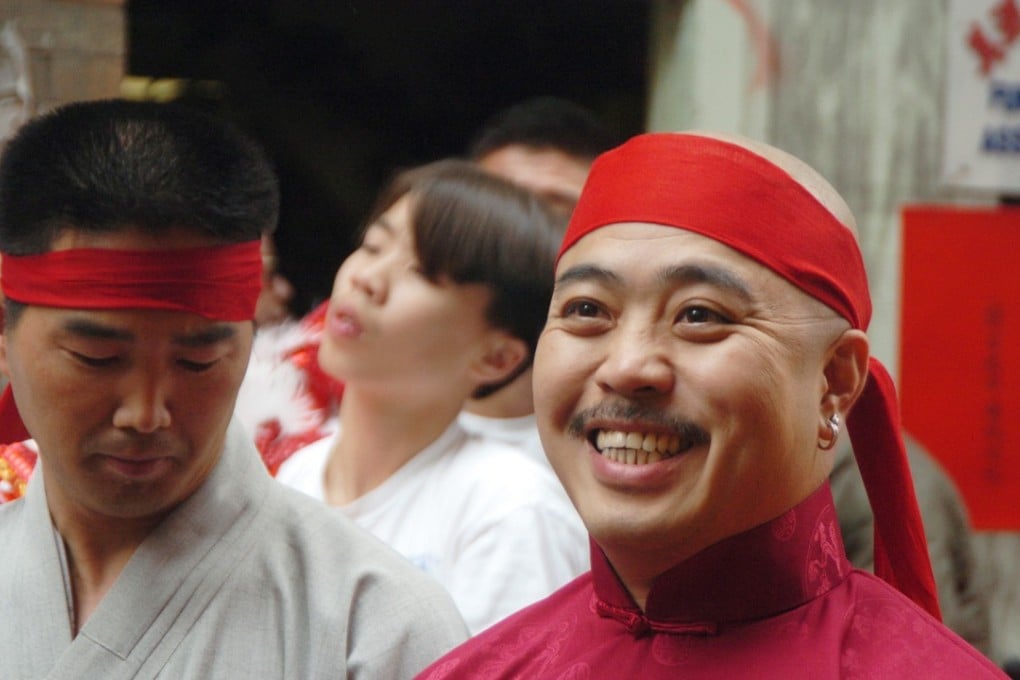 Raymond “Shrimp Boy” Chow smiles after being sworn in as the “Dragon Head”of the Chee Kung Tong in Chinatown in San Francisco in 2006. Photo: AP