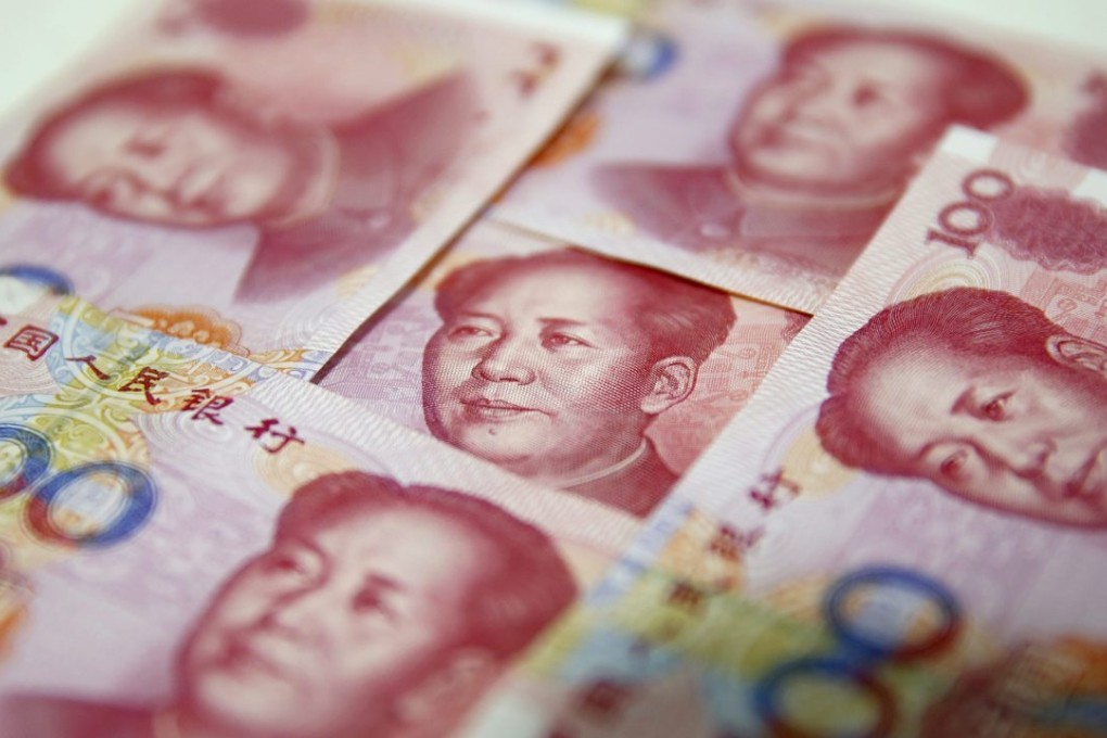 Chinese 100-yuan notes are seen in Beijing as the currency fell back to No. 5 in global payments in September. Photo: EPA