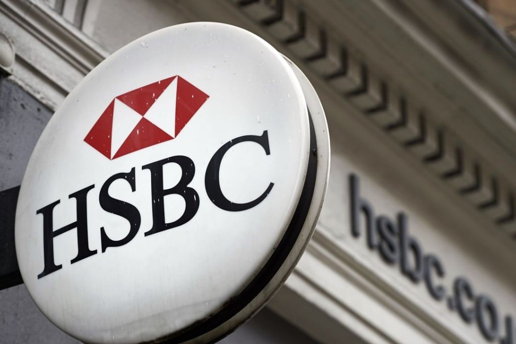 An HSBC bank logo is seen on a sign outside a branch of the bank in London as the lender set off on the latest leg of its journey to exit bad businesses. Photo: AFP