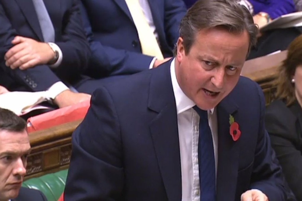 British Prime Minister David Cameron answers a question during prime minister's question time in the House of Commons chamber in London. Photo: AFP