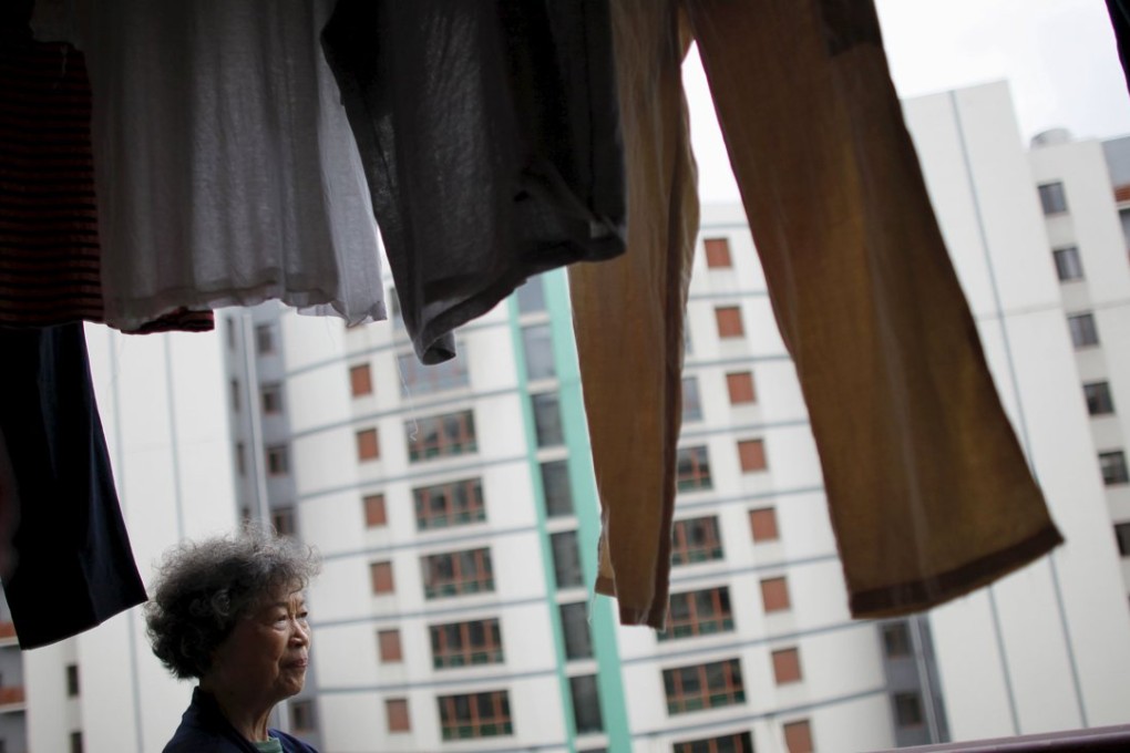 Zhu Yuefeng, 75, stands on the balcony of her apartment at the Cherish Yearn care center facility in Shanghai as China relaxed its restrictions on how many children families can have. Photo: Reuters