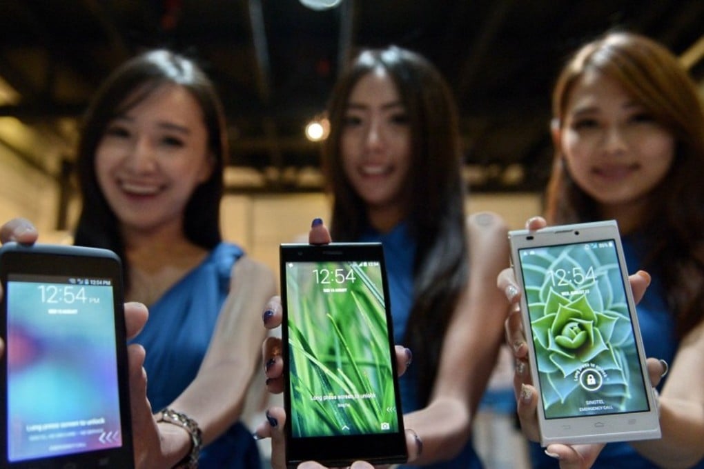 Chinese models show off handsets by ZTE. Chinese smartphone vendors are expected to benefit from the landmark deal. Photo: SCMP Pictures