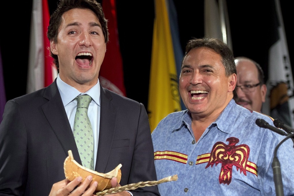 Justin Trudeau receives a gift of sweetgrass and a minature canoe from National Chief Perry Bellegarde after addressing the Assembly of First Nations congress in Montreal in July. Photo: Ryan Remior/The Canadian Press via AP