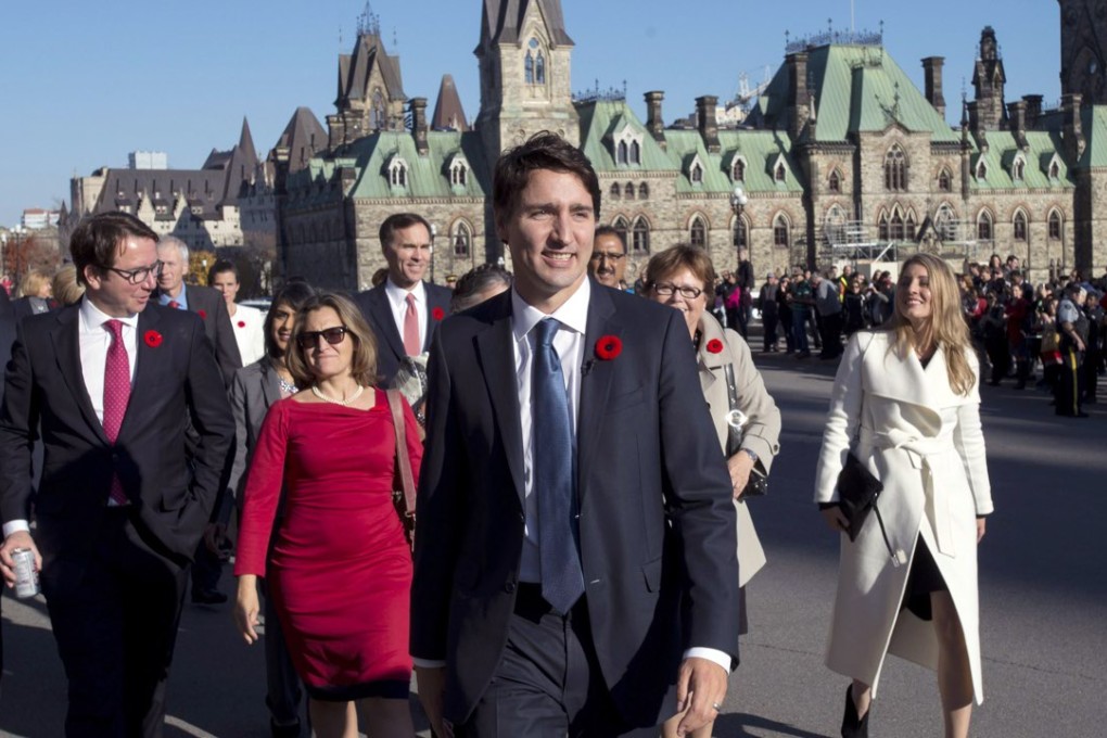 Prime Minister Justin Trudeau and his newly sworn-in cabinet ministers arrive on Parliament Hill in Ottawa on Wednesday. Photo: AP