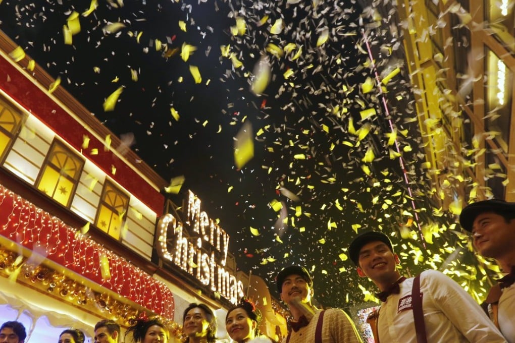 Christmas decorations with a Disneyland theme are lit up outside a shopping mall, during an early Christmas ceremony in Hong Kong, China. Photo: Reuters