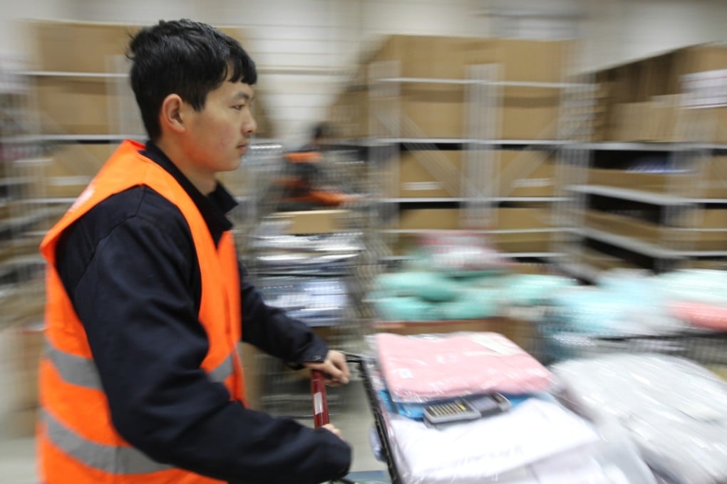 Workers at Beijing Rufengda Express prepare for the Double 11 rush in the days before the shopping festival. Photo: Simon Song