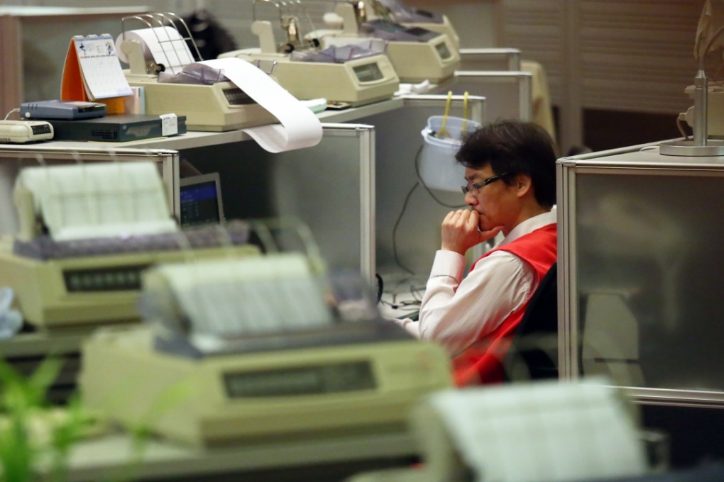 Floor traders are seen at the Hong Kong stock exchange in the Central business district. Photo: Nora Tam