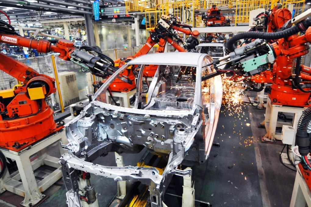 Robotic arms at work on an assembly line for Chinese automaker Geely in east China's Zhejiang Province. Photo: Xinhua