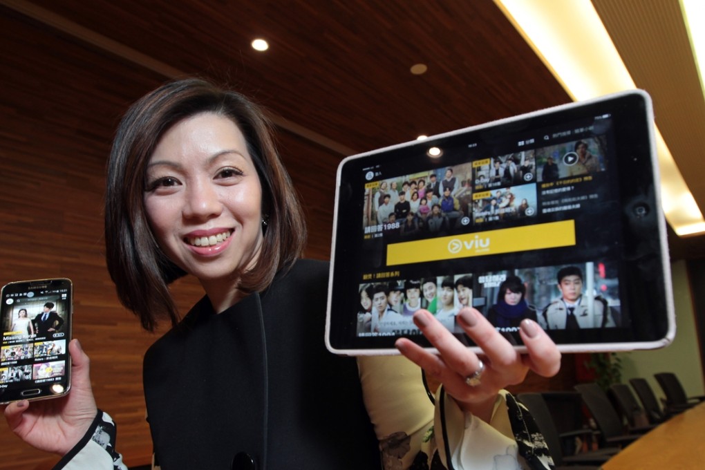 Janice Lee, managing director of PCCW Media Group, with the newly launched mobile device application 'Viu', an OTT video platform in Wan Chai. Photo: Bruce Yan