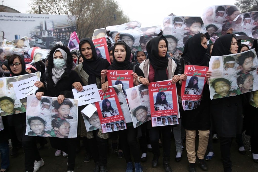 Women march in the Afghan capital of Kabul on Wednesday with pictures showing ethnic Hazaras who were recently found murdered. Photo: AFP