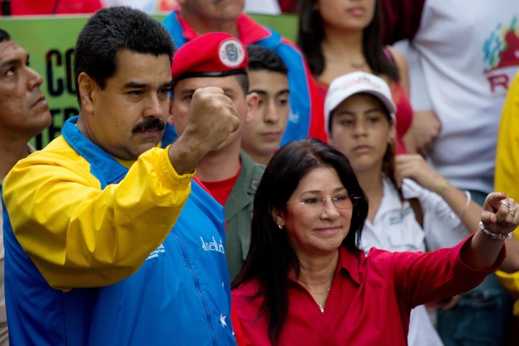 Venezuela's President Nicolas Maduro and first lady Cilia Flores greet supporters in Caracas in 2014. Flores is a powerful presence in her husband’s administration. Photo: AP