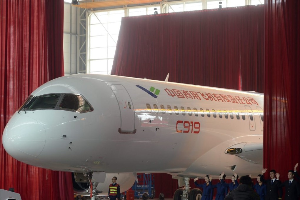 Workers roll out the first C919 passenger jet at the state-owned Commercial Aircraft Corporation of China (COMAC) in Shanghai on November 2. Scientists say the new pure-metal breakthrough could make Chinese planes of the future even more competitive and safer. Photo: EPA