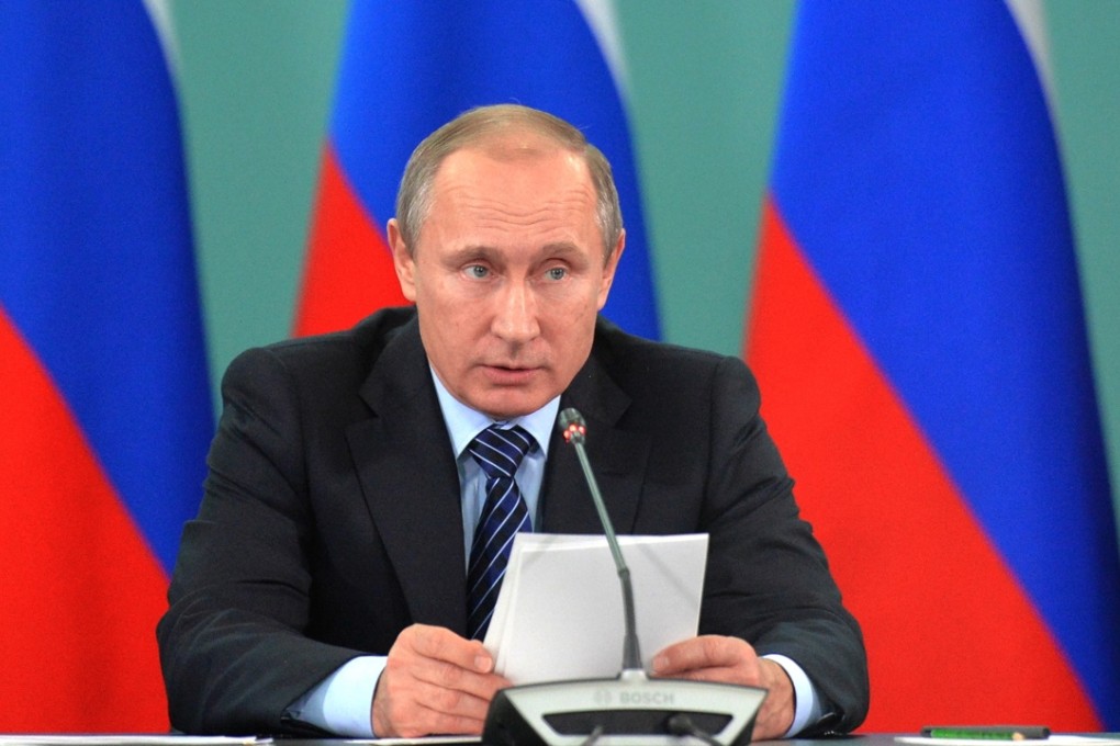 Russian president Vladimir Putin speaks during his late-night meeting with the heads of Russia's sports federations. Photo: AP