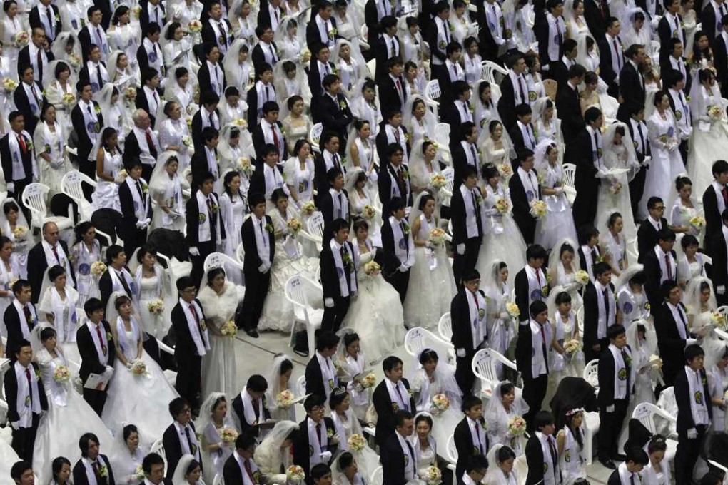 Thousands of newlyweds attend a mass wedding ceremony of the Unification Church at Cheongshim Peace World Centre in Gapyeong. Photo: Reuters