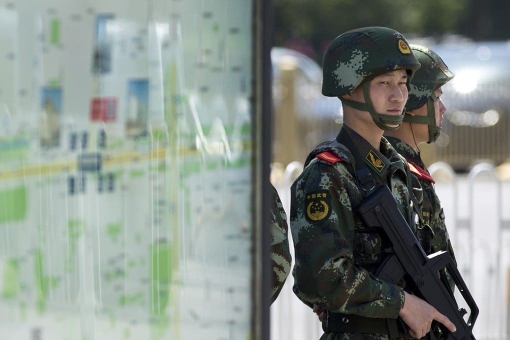 Armed Chinese paramilitary policemen stand guard in Beijing. Photo: AP