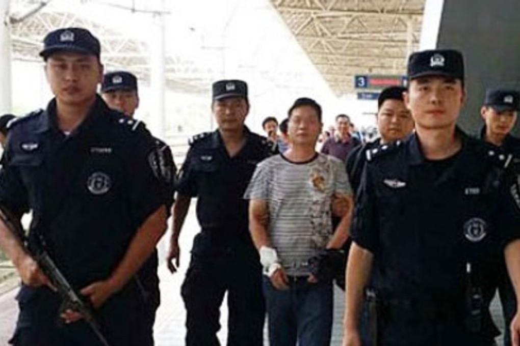 Police escort a suspect during the nationwide operation, Photo: China Police Daily