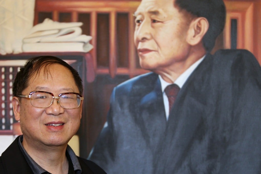 Hu Dehua poses in front of a photo of his father, the late leader Hu Yaobang. Photo: Simon Song