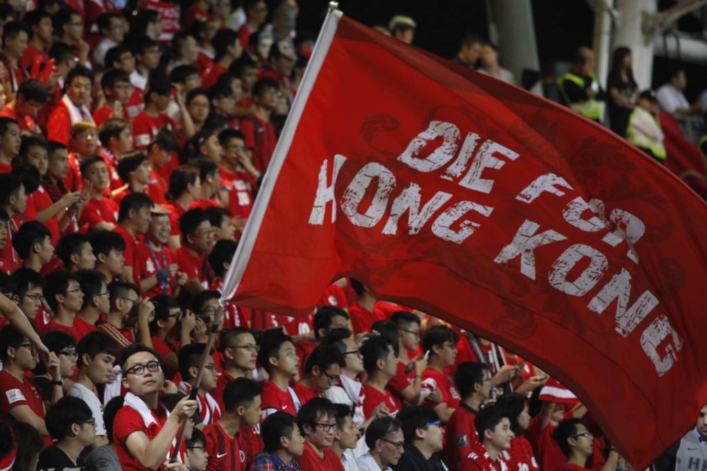 A Hong Kong Fan waves a flag that reads "Die for Hong Kong". Photo: AFP