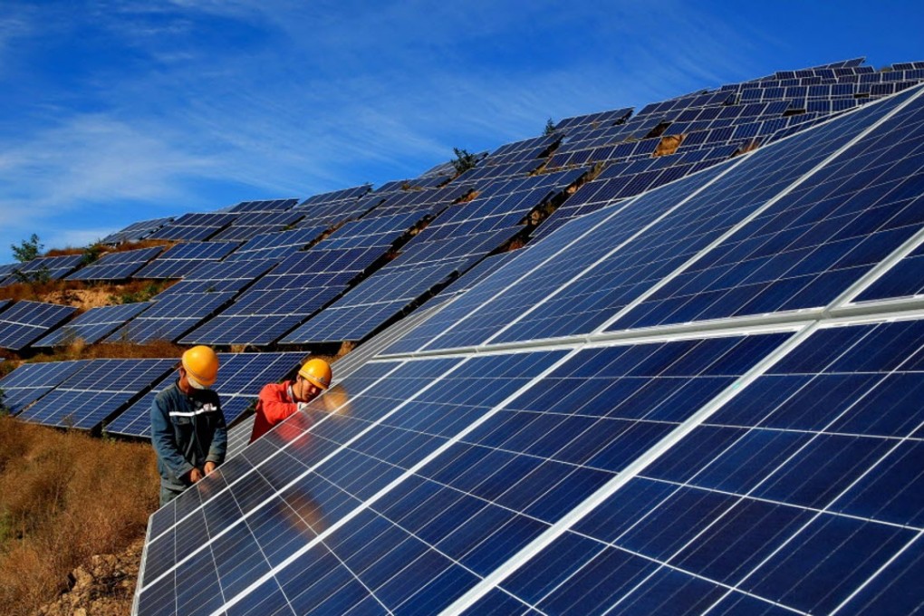Workers construct a solar power field in Qinhuangdao, Hebei province. Guodian Tech says the mainland’s solar industry sector faces challenges. Photo: Xinhua