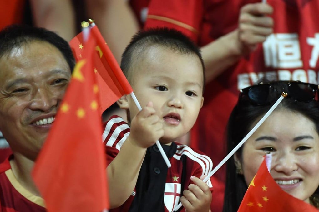 Fans of Guangzhou Evergrande react during the 1st leg of the final. Photo: Xinhua