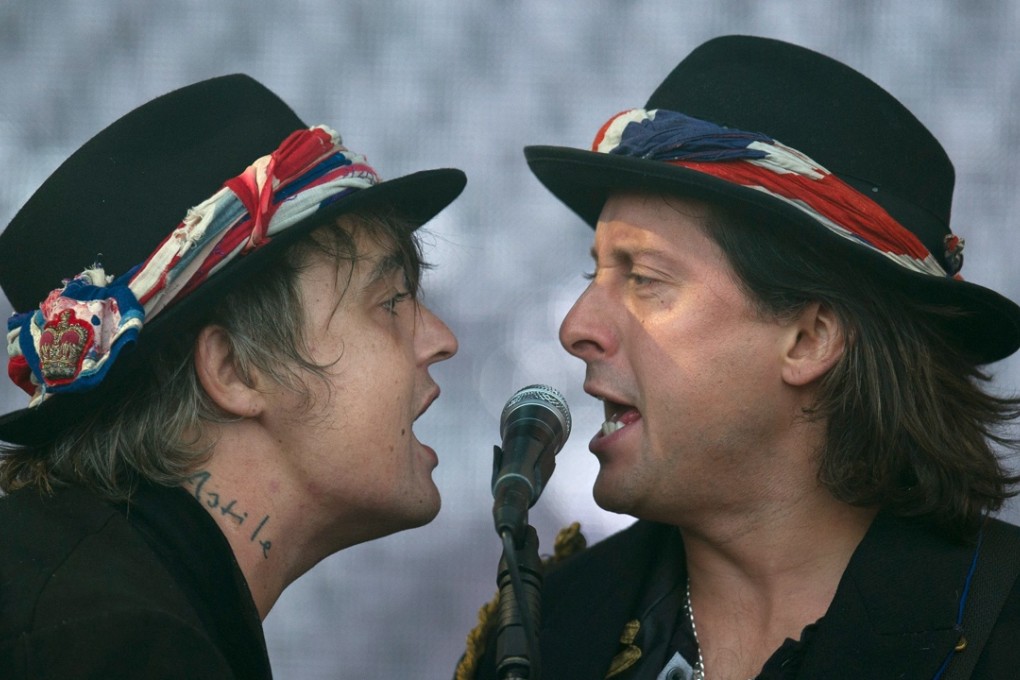 Pete Doherty (left) and Carl Barat of the Libertines on the Pyramid Stage at Glastonbury Festival in 2015. Photo: AFP