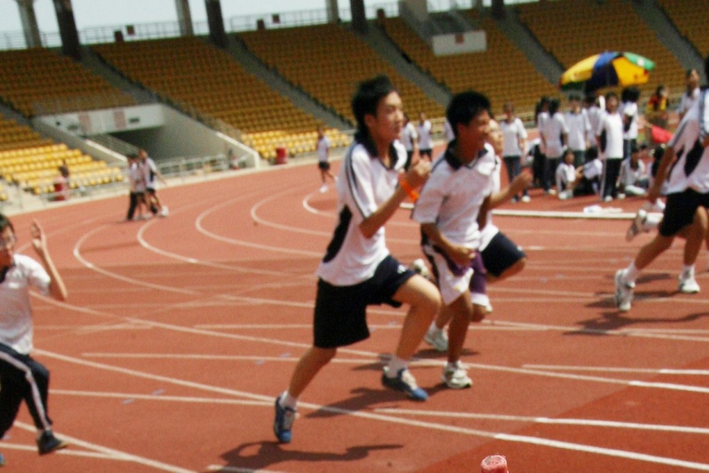 Children at some schools in Guangzhou and Jiangsu provinces have fallen sick, with some suffering dizziness and nosebleeds, after using newly laid running tracks. File photo: SCMP Pictures