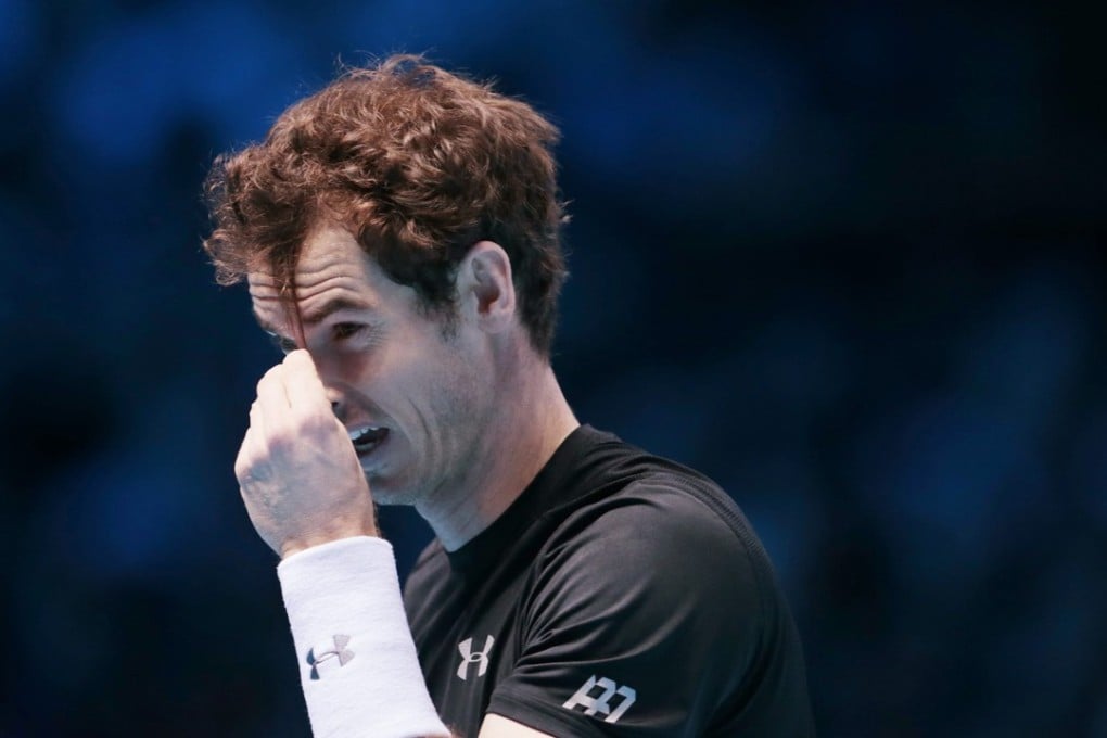 Andy Murray complains about the length of his hair during his match against Rafael Nadal. Photo: Reuters