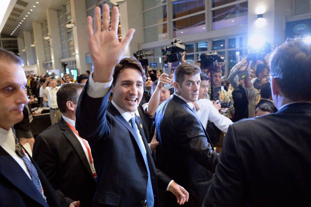 Canada's Prime Minister Justin Trudeau waves to members of the media and volunteers at the Asia-Pacific Economic Cooperation (APEC) Summit in Manila. Photo: AFP