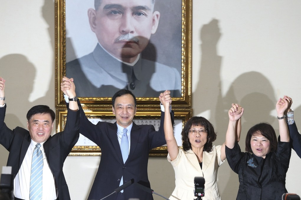 Wang Ju-hsuan (second from right), joins hands with her presidential elections counterpart Eric Chu (second from left), chairman of the ruling Kuomintang (KMT) at the KMT headquarters in Taipei on Wednesday. Photo: CNA
