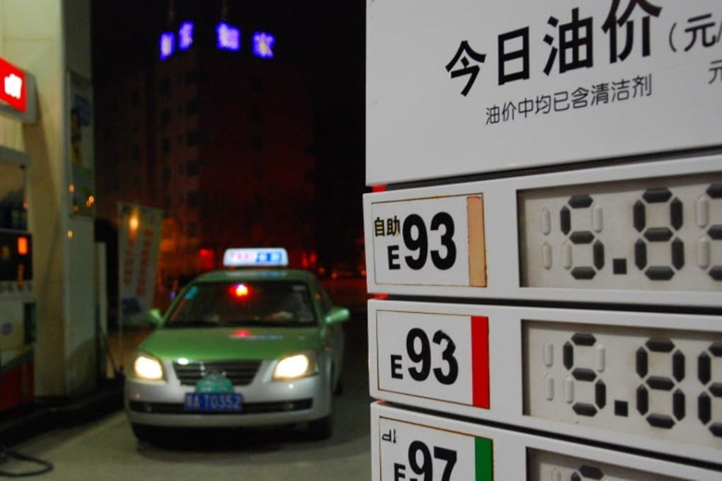 A taxi car is refuelled at a gas station in Zhengzhou, capital of central China's Henan Province as Beijing announced cuts in natural gas prices and that it is stepping away from price setting. Photo: Xinhua