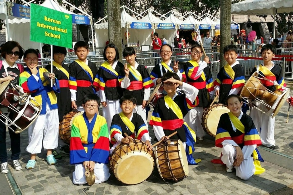 Students from Korean International School prepare for a traditional drumming performance at the Asian Ethnic Cultural Performances 2014 in Tsim Sha Tsui in November.