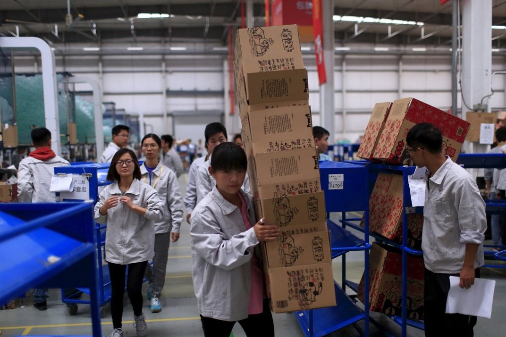 Employees work at a Tmall logistic centre in Suzhou, Jiangsu province, on October 28. Photo: Reuters