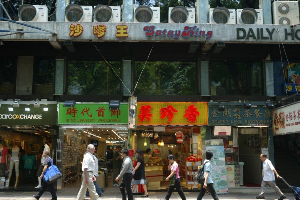 Shops open to the street and air-conditioning units in Tsim Sha Tsui. Hongkongers need to consider all aspects of their energy consumption.