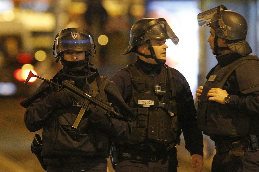 Police forces in St Denis, a northern suburb where suspects of the Paris attacks were hiding. Photo: AP