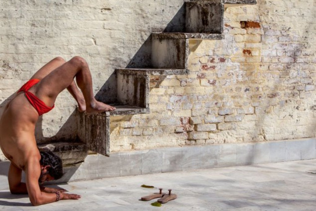 This image shows Stairway to Where?, vrischikasana (scorpion pose). Haridwar, March 10, 2009. Photo: Taschen