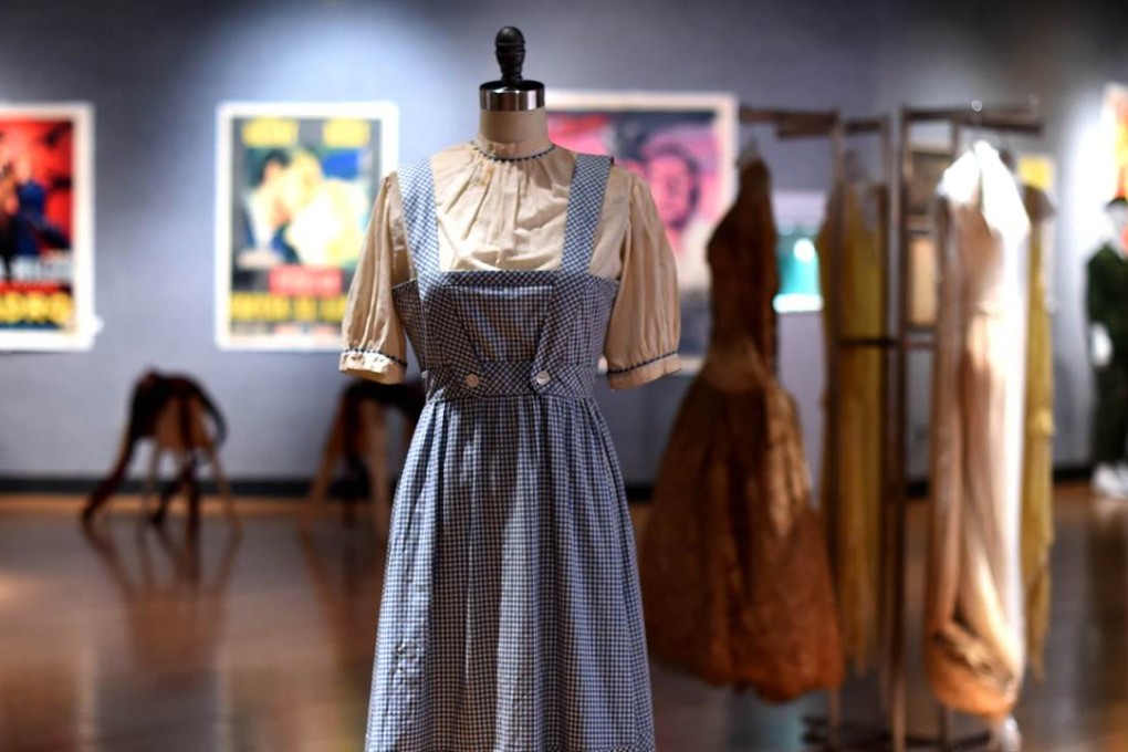 This blue-checked dress made for classic film “The Wizard of Oz” is believed to be one of only two that was actually worn star Judy Garland. Photo: AFP