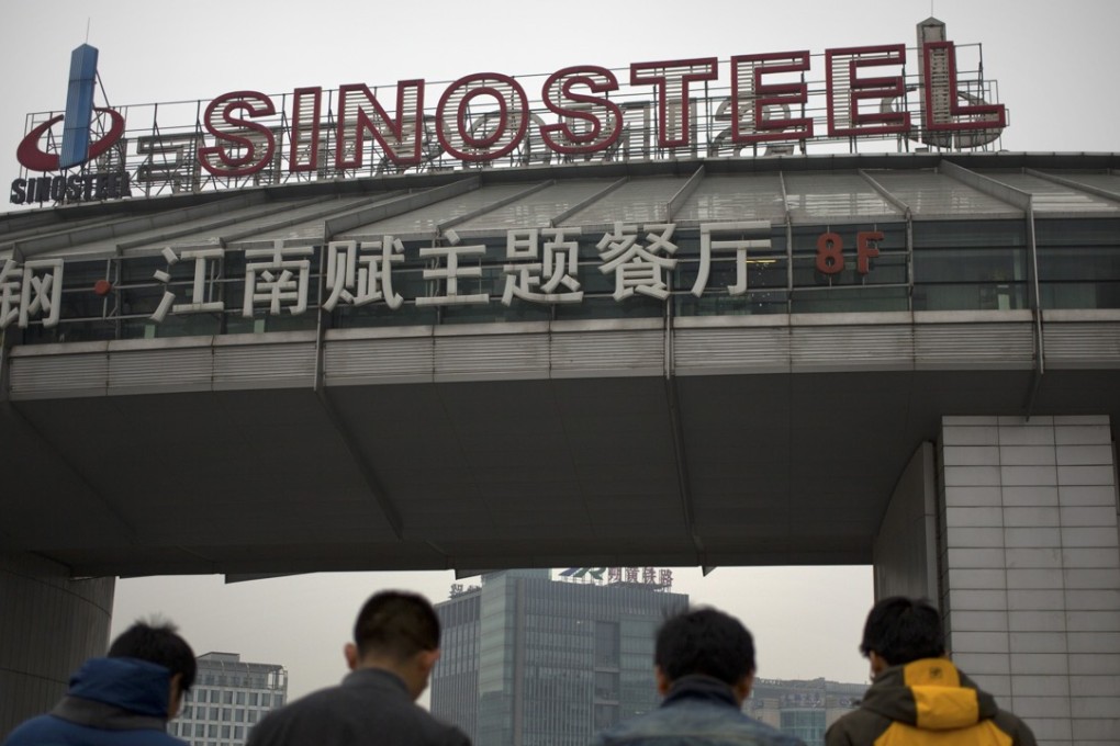 People walk outside of the SinoSteel Corp. headquarters in Beijing. China. Photo: AP
