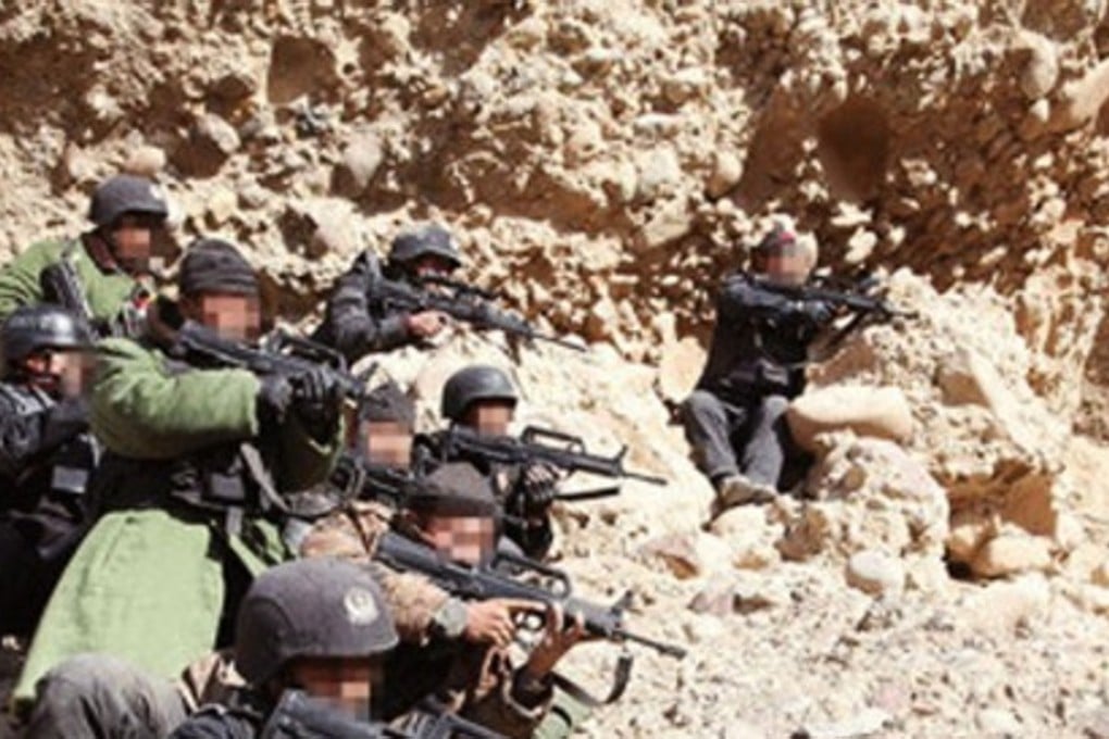 Chinese paramilitary forces taking part in the manhunt for the militants who attacked a mine in Xinjiang two months ago. Photo: SCMP Pictures