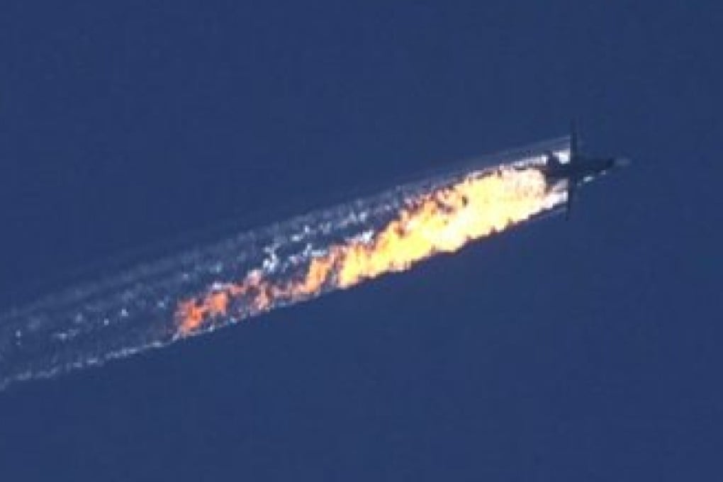 A still image of a burning trail from the Russian bomber jet which was shot down. Photo: EPA