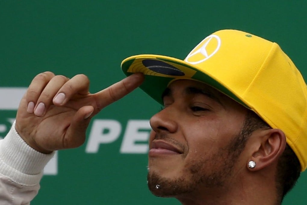 Lewis Hamilton celebrates after the Brazilian Grand Prix. Photo: Reuters